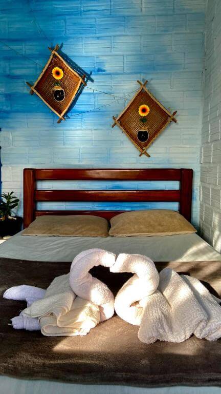 Quarto do Vila Flexal Pousada em Alter do Chão, em Alter do Chão no Pará, com cama de casal, e toalhas