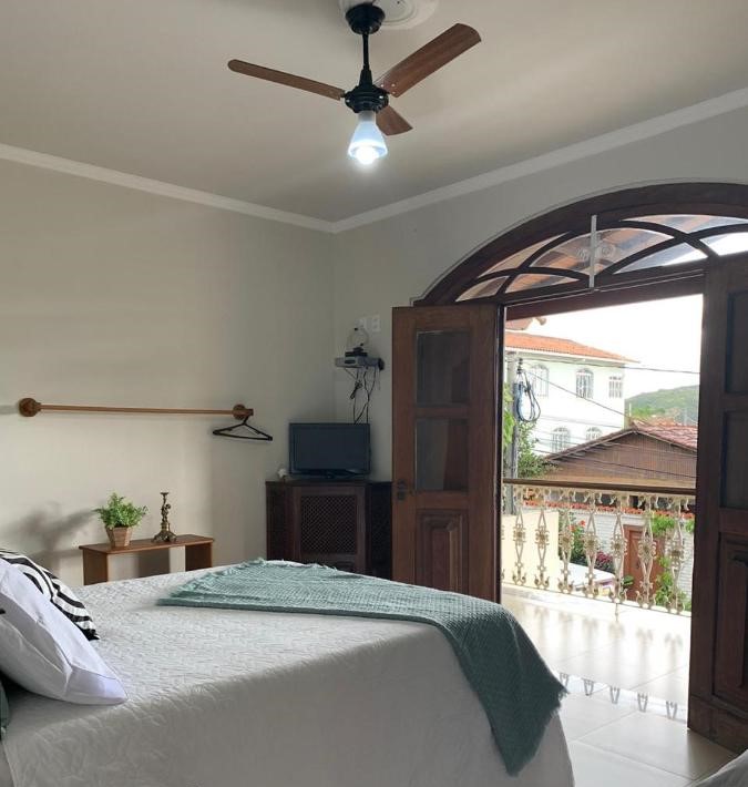 Quarto com varanda em pousada pet friendly em Minas Gerais